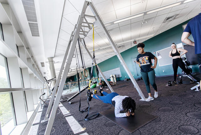 Students using pilates equipment in Merritt Fitness Center.