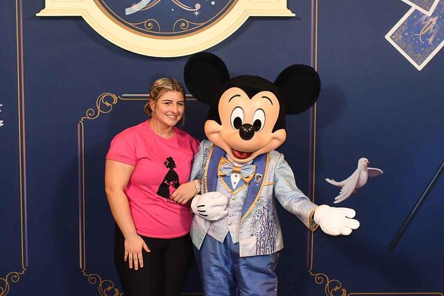 Girl in pink shirt with Mickey Mouse 