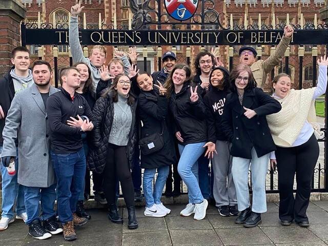 Students standing in front of a University in Ireland 