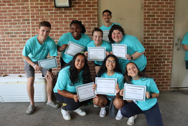 A group of people in blue 