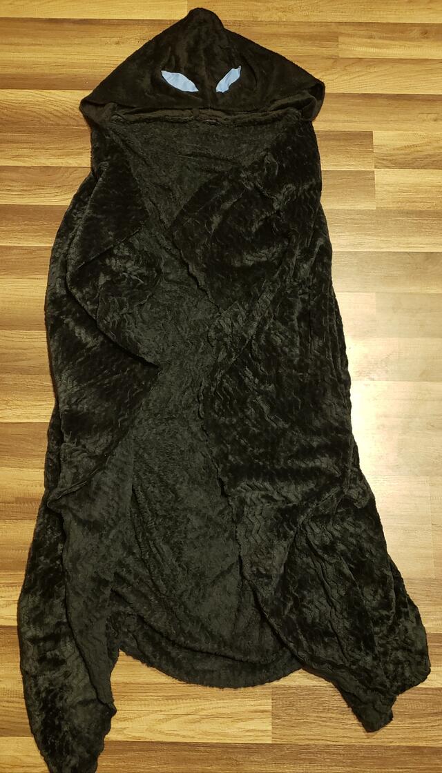 A felt black cloth with a face. 