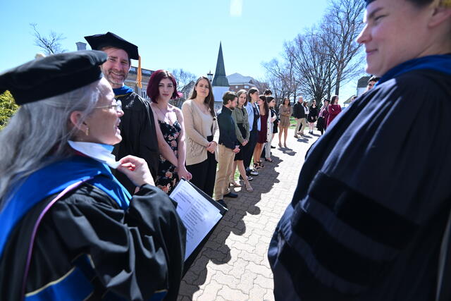 Students being inducted into Phi Beta Kappa.