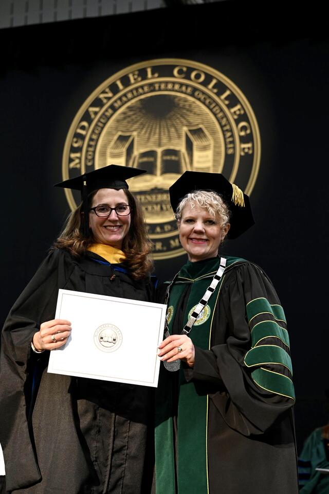 Kerry Duvall with President Jasken at 2023 Commencement.