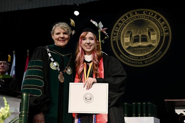 Photo of Stephanie Eckard and President Jasken.