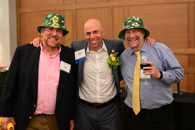 Greg Merril '87 and friends wearing the Alumni Weekend bucket hats.
