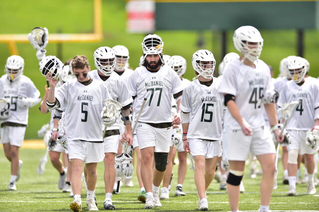 Men's Lacrosse players walking