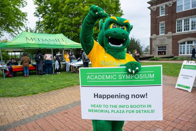 Green Terror holding Academic Symposium Sign