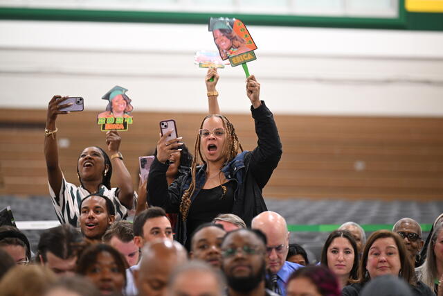 Family Members cheer on gradaute