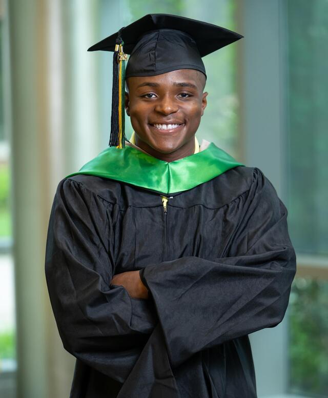 Headshot of Habeeb Baba wearing graduation regalia.