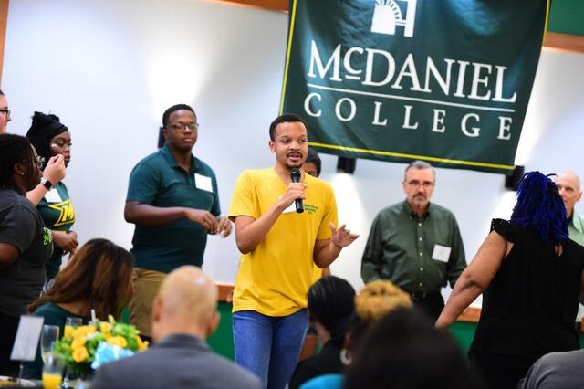 Alumnus speaking at the Homecoming DEI Brunch