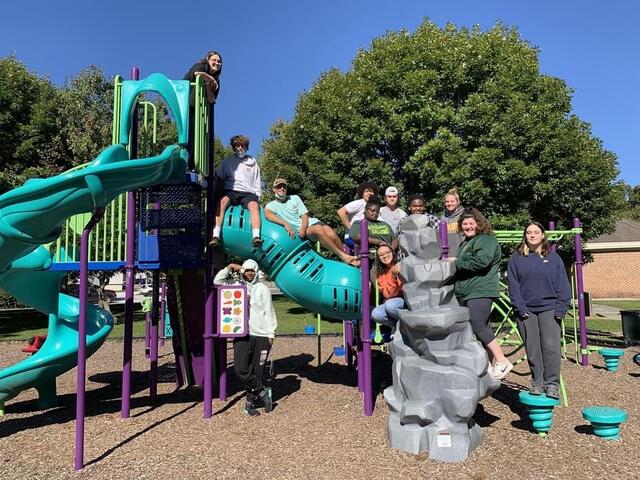 A group of students standing on the playground