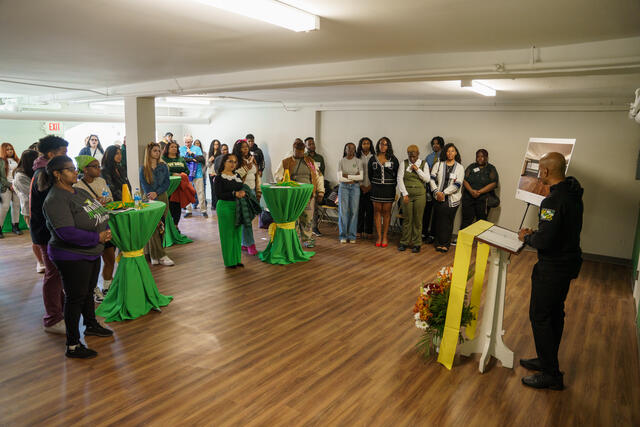 College Chaplain, Richard Smith, speaks in front of a group of people