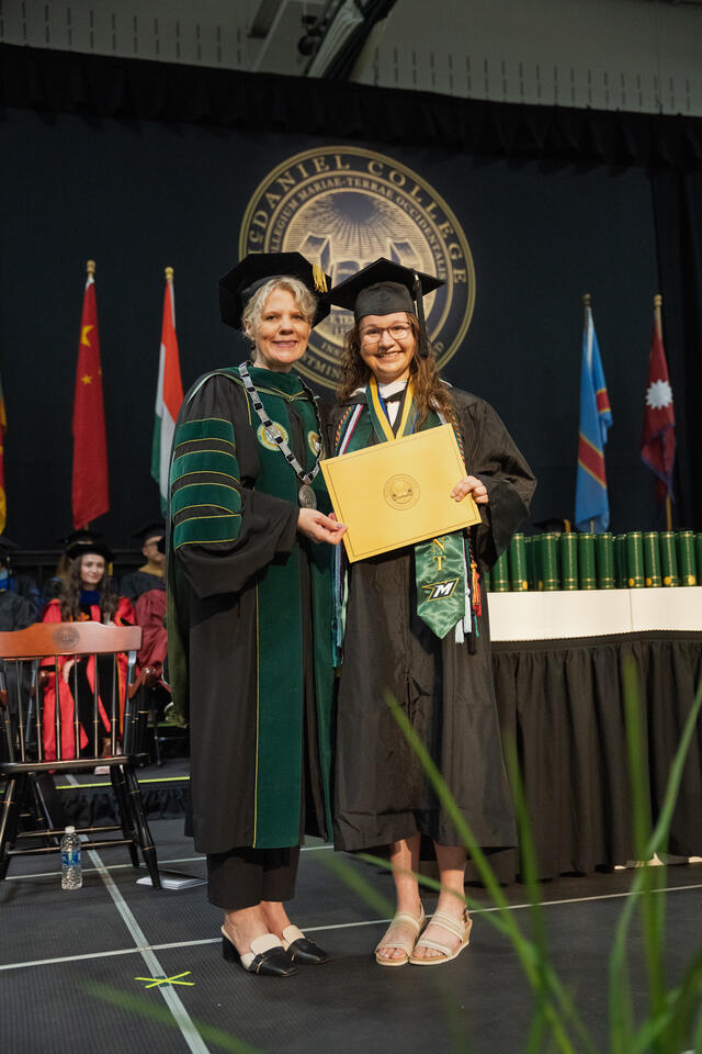 President Jasken poses with the recipient of the Edith Farr Ridington Writing Award, Mackenzie R. McCarter