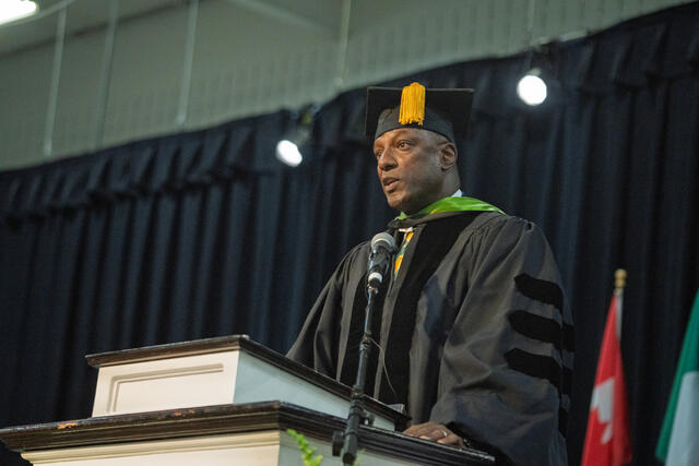 Retired Col. James Martin Jr. ’93 speaks at a podium