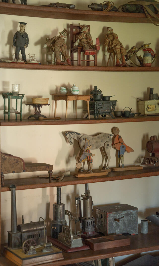 A selection of figurines on a shelf.