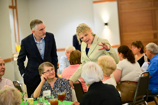 President Julia Jasken visits with alums at the Alumni Weekend presidential luncheon.