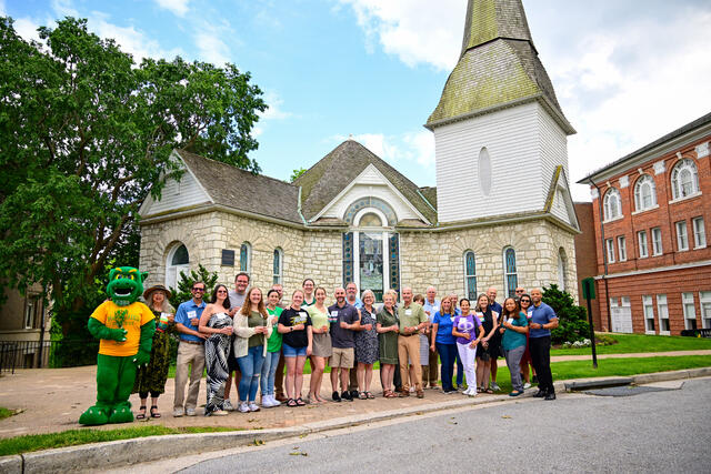 Alumni couples pose in front of Little Baker after the vow renewal ceremony.