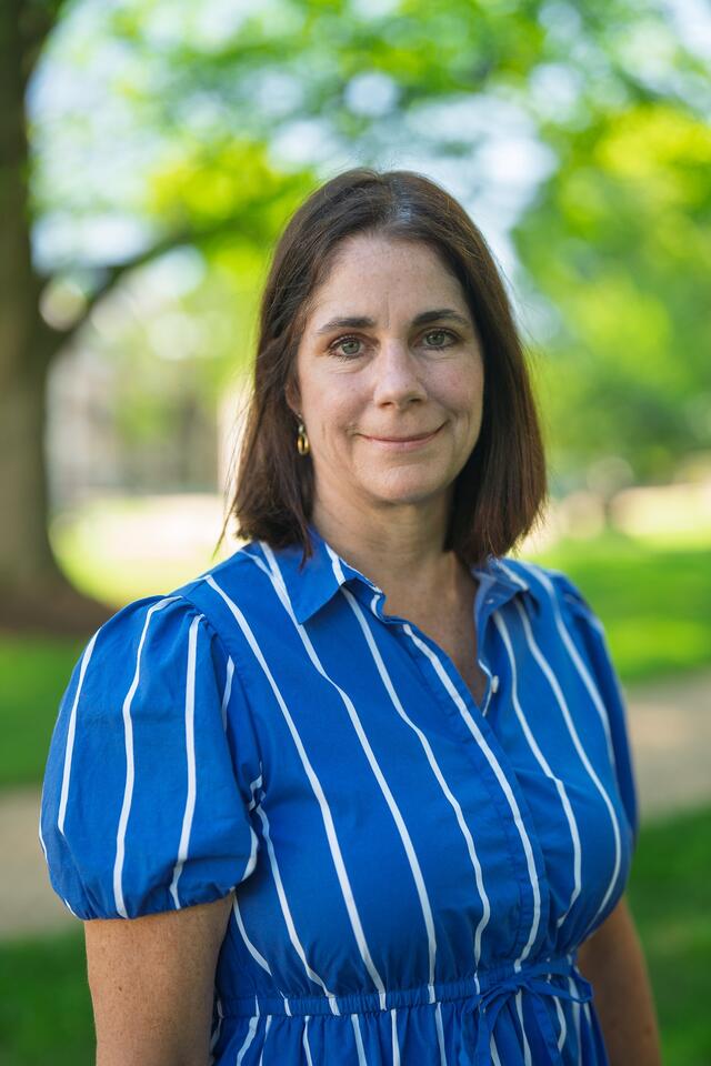 Estep, Laura_School Counseling wearing a blue and white vertical striped shirt 