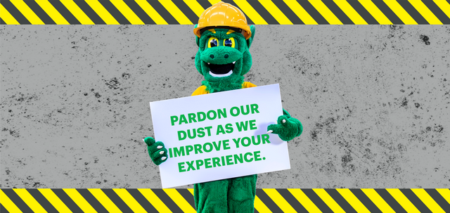image of the green terror in a hard hat holding sign that says, "Pardon our dust as we improve your experience."