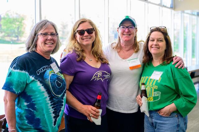 Women's sports alum gather for a pic. 