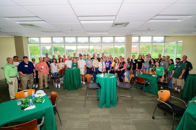 Group shot of the alumni at the Green & Gold happy hour.