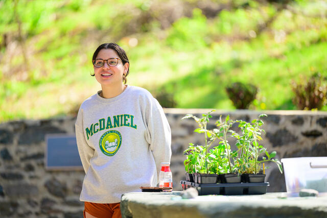 A student presents on her work at the renovated Harvey Stone Park. 