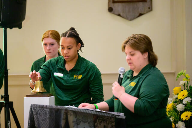 Student Alumni Ambassadors conduct the Memorial Bell Ringing ceremony. 
