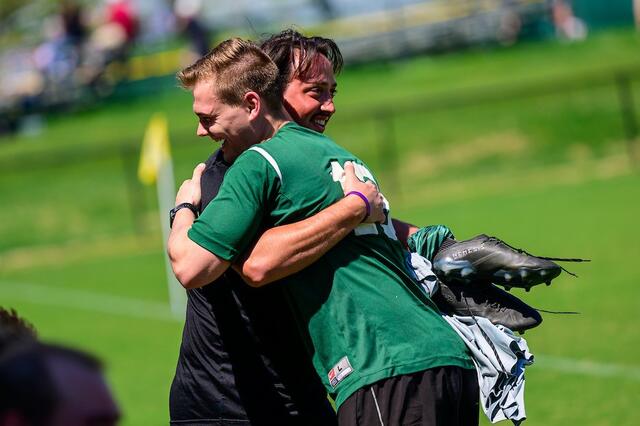 Alumni bid each other well after the Men's Soccer alumni game.