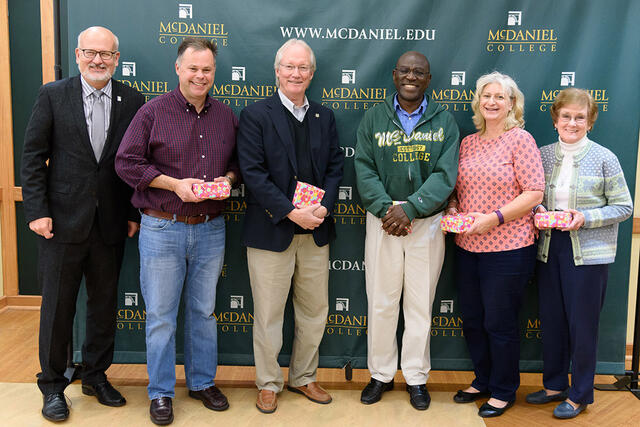 Photo of faculty and staff who have given 20 years of service to the college. 