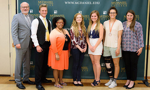 McDaniel President Roger Casey (left) and Kristen Maddock (right) with Duke of Edinburgh awardees (l. to r.) Carter Trousdale, Zoe Lewis, Angel Petty, Carinna Powell and Alyssa Swartz.