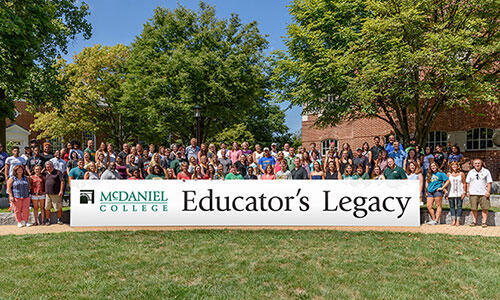 A picture of the Class of 2020 Educator's Legacy Scholarship recipients and their families.