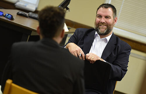 Jim Dahlgren â06, president of WPM Real Estate Management, interviews senior Business Administration major Andre Henry of Frederick, Md.