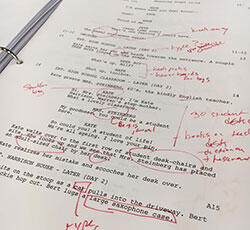 A photo of a marked-up script. 