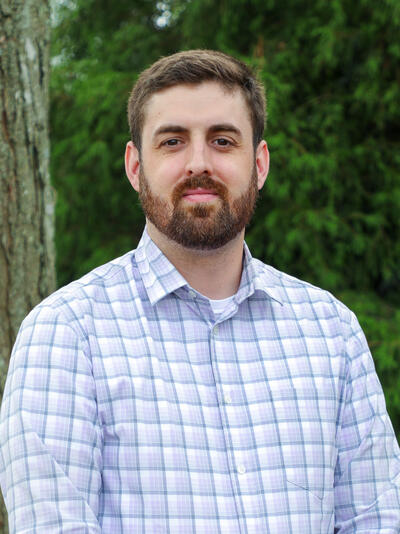 Headshot of Justin Forget.