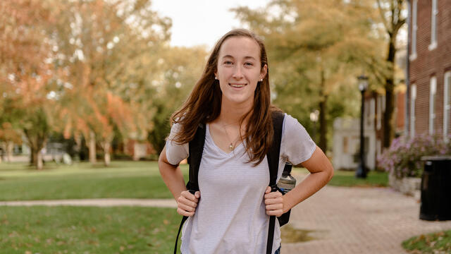 Student walking across campus.