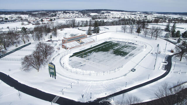 Aerial photo of McDaniel College football stadium covered in snow.