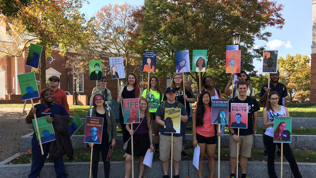 Students holding election signs.