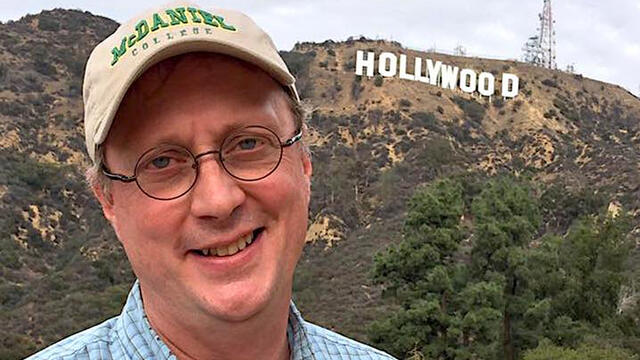 Hollywood Insider Jonathan Slade, Cinema Prof in front of Hollywood sign.