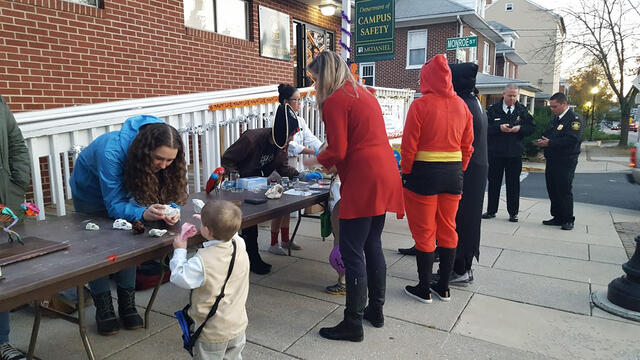 Students and kids dressed in costumes for the STEM Halloween.