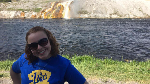 McDaniel College alumna Melissa Fry '17 stands during her internship in Yellowstone National Park's Midway Geyser Basin.