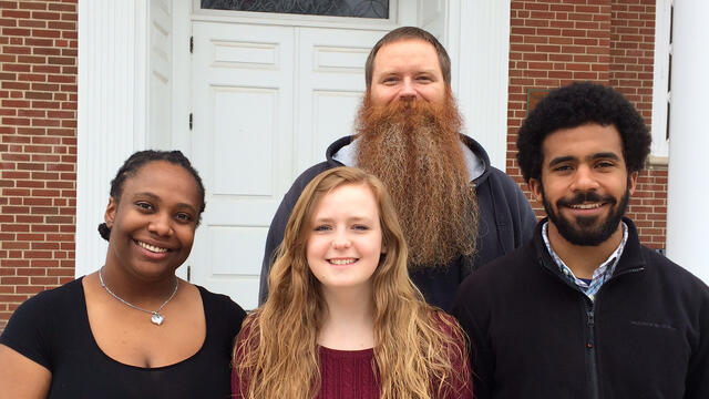 Religious Studies professor Brad Stoddard with students presenting on Religion and Race at national conference