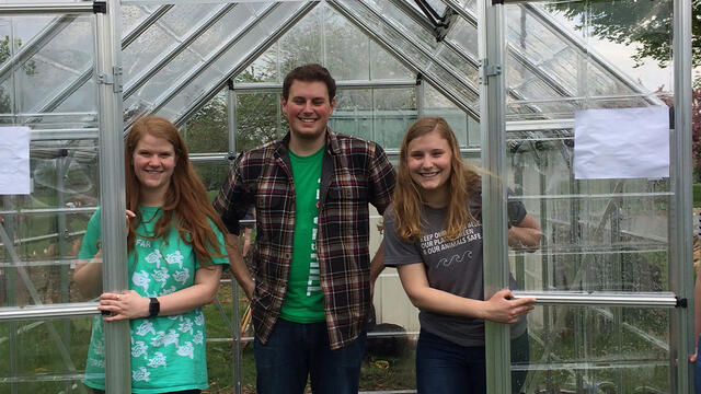 Katie Holland, Atticus Rice and Cari Witherow in McDaniel College greenhouse