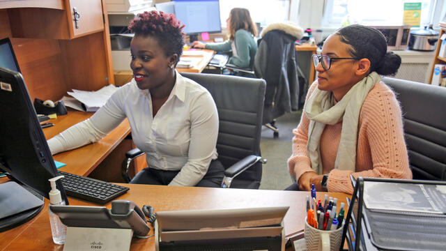 McDaniel College Financial Aid Director Kemia Himon assists Financial Aid Specialist Aza Smith