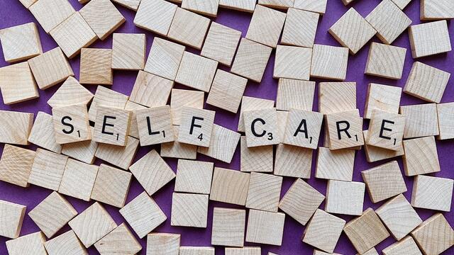 Self care graphic with scrabble tiles