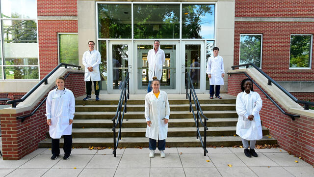 2020 summer research students and professor Dana Ferraris on Eaton Hall steps