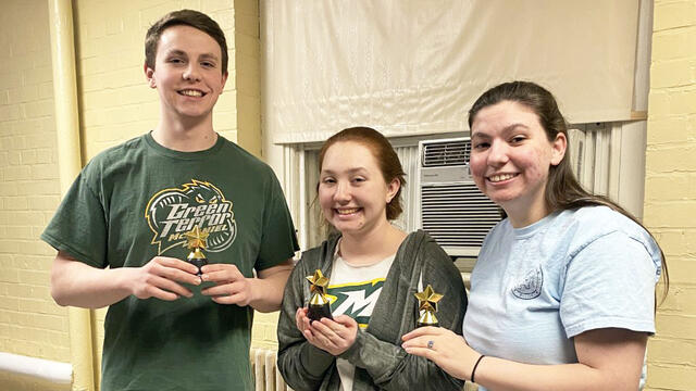 McDaniel junior Zachary Ruggerie, left, with fellow students Anna Petenbrink, center, and Laura Midkiff, right.