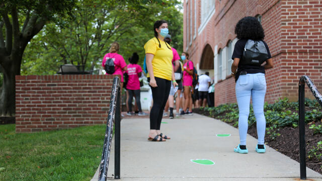 students talking wearing masks
