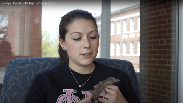 Biology Student with Lizard
