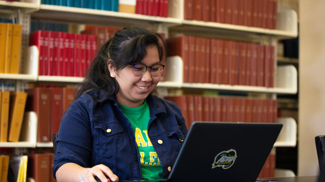 student in library