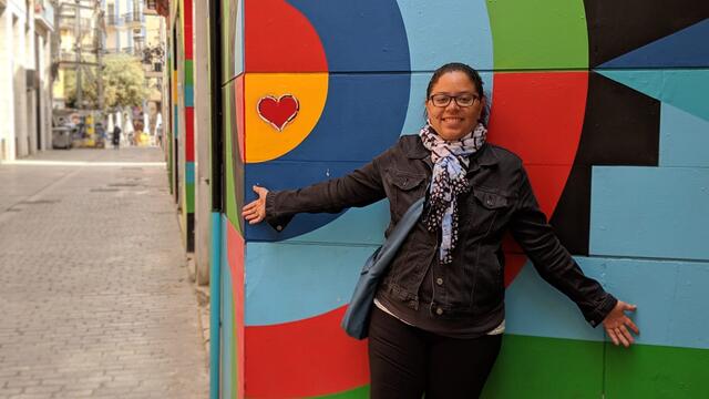 Alumni Jessica Watson in front of street art in Valencia, Spain.